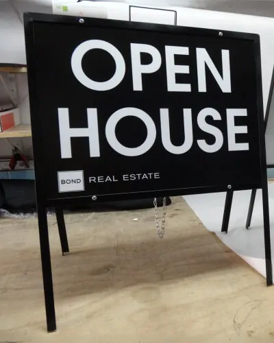 a frame sign for open house