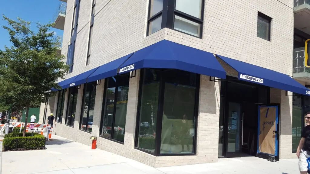 supply co blue color awning for distribution and manufacturing industry