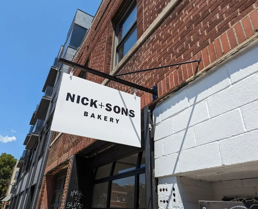 nick and sons bakery custom hanging outdoor blade sign