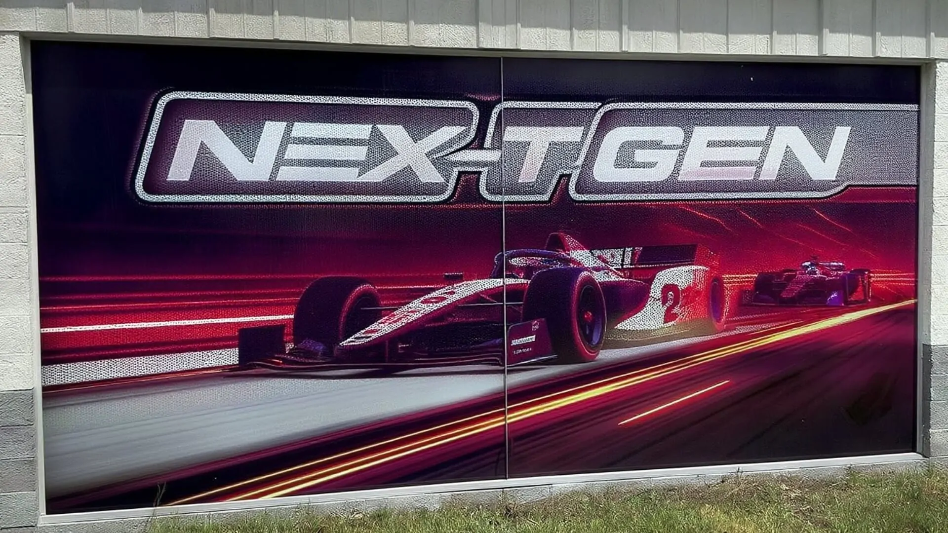 auto shop perforated window wrap with racecars and motion effects