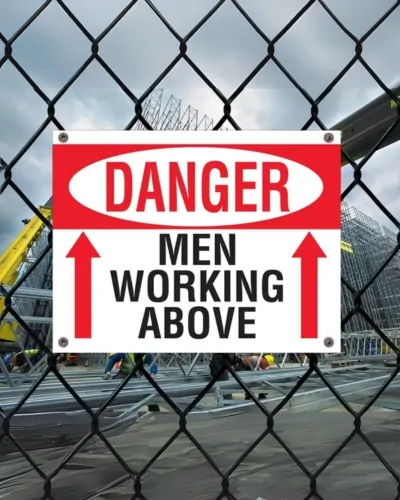 construction site men working above signs nyc