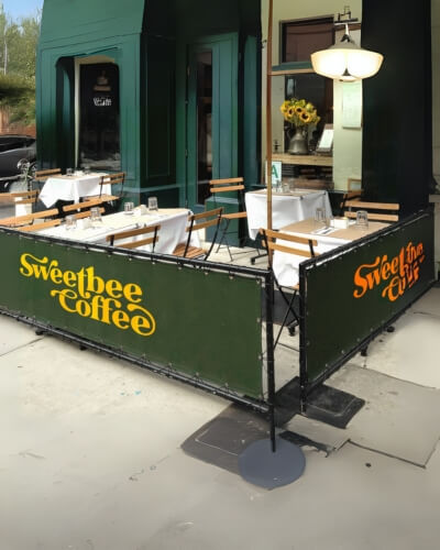 green sidewalk cafe barriers
