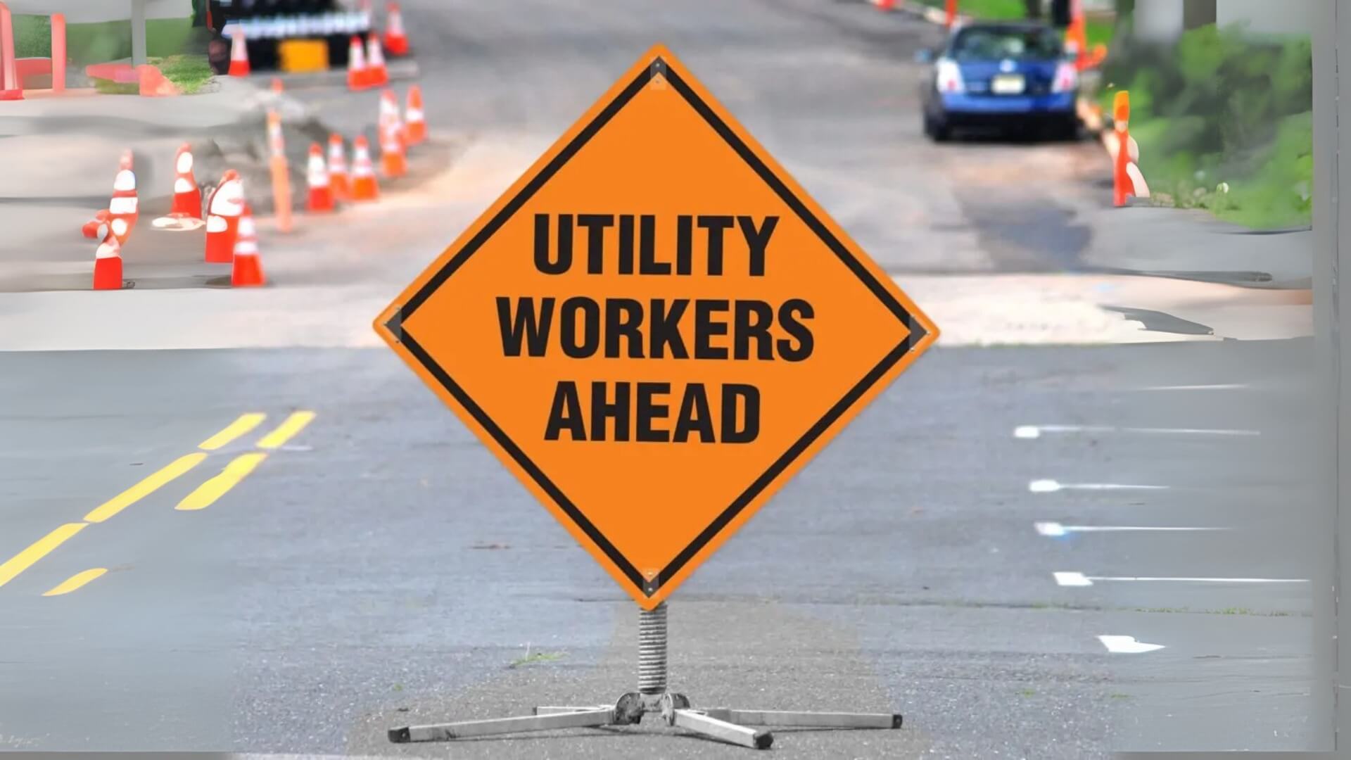 utility workers ahead closed signs