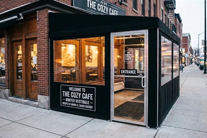 Black temporary winter vestibule for restaurant in nyc