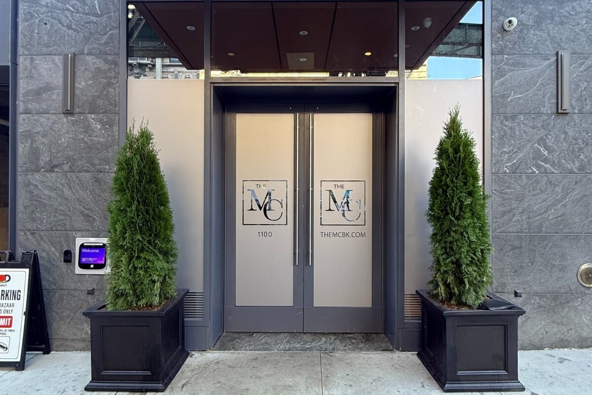 Symmetrical entrance door privacy film with custom logo