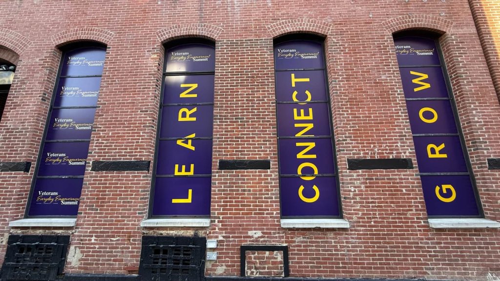 vinyl window banners on brick building nyc