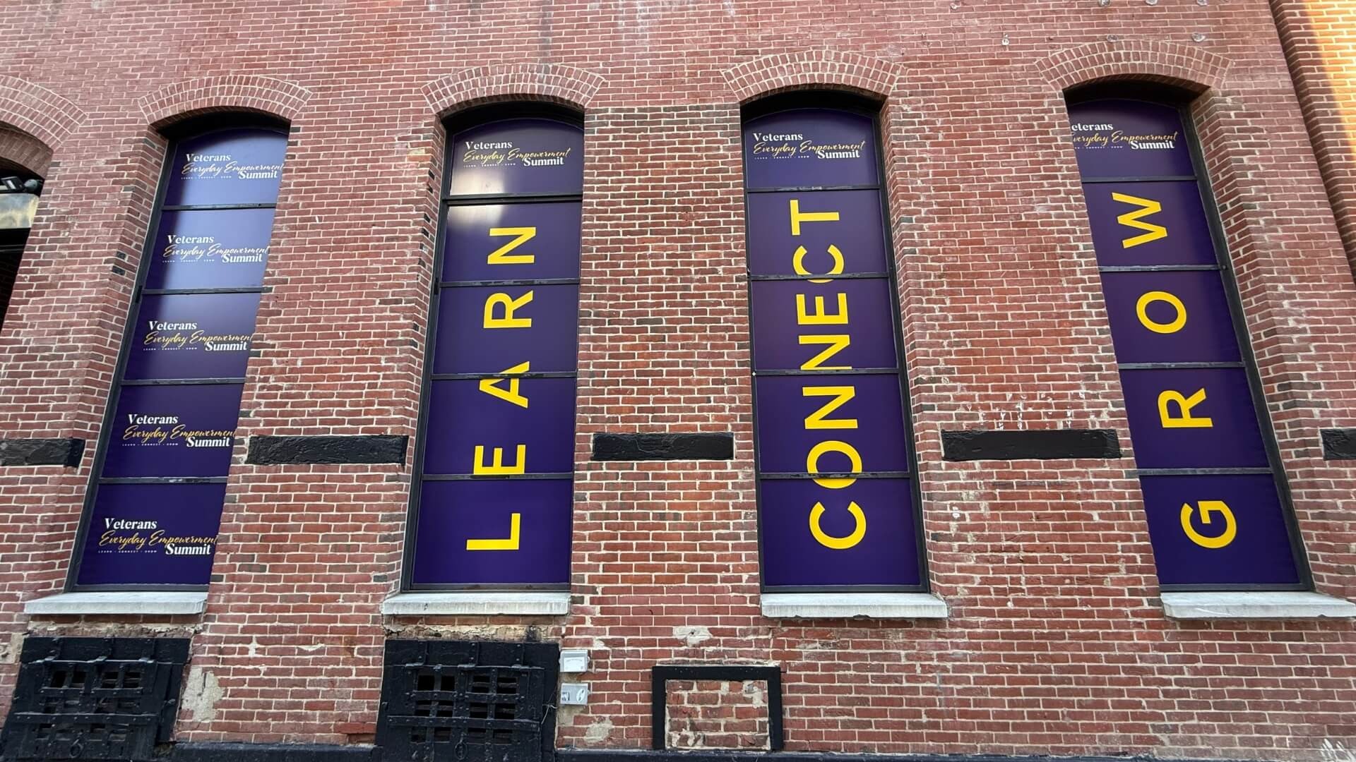 vinyl window banners on brick building nyc