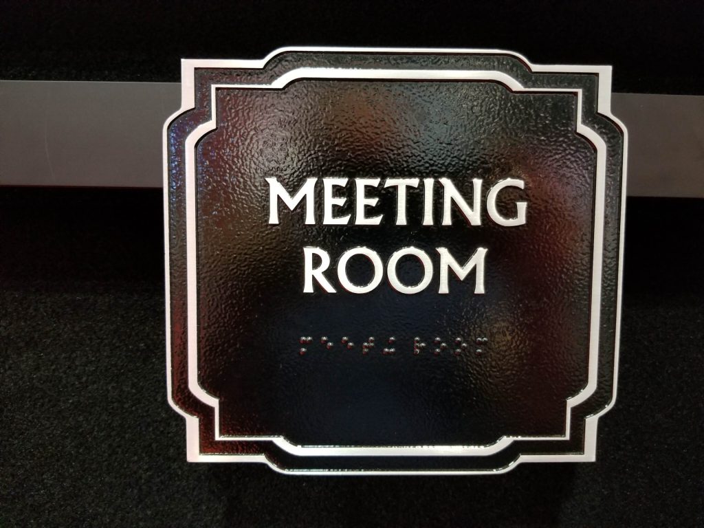 ADA meeting room sign with braille nyc