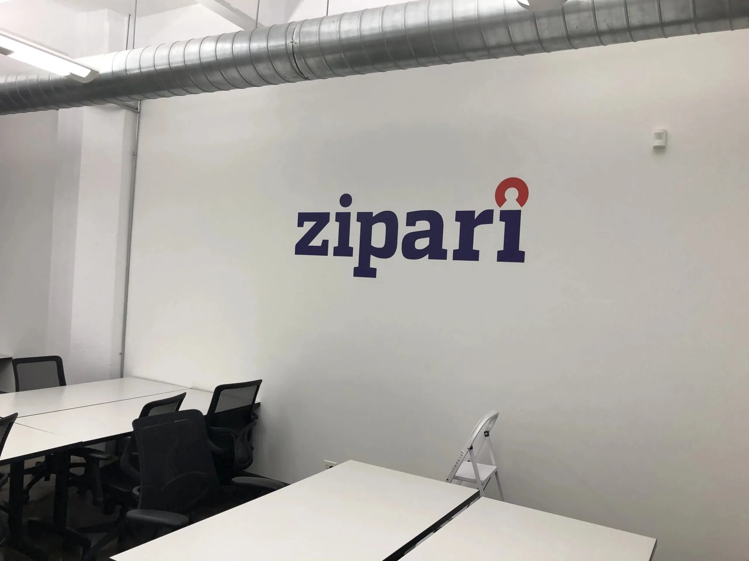 Zipari logo vinyl lettering on office interior wall nyc