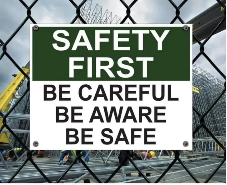 Safety First sign on a construction site fence